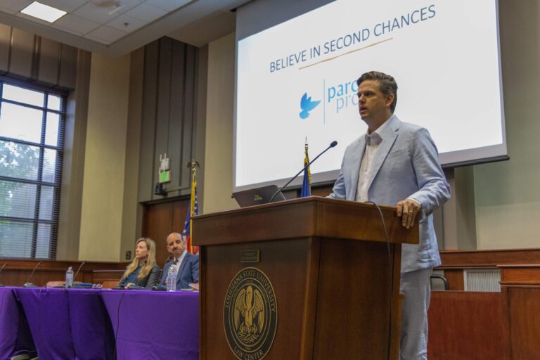 Andrew Hundley speaking at a conference at the LSU Law Center