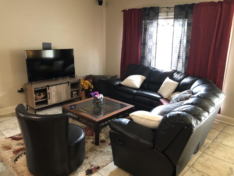 Redemption home living room with leather recliner and pillows